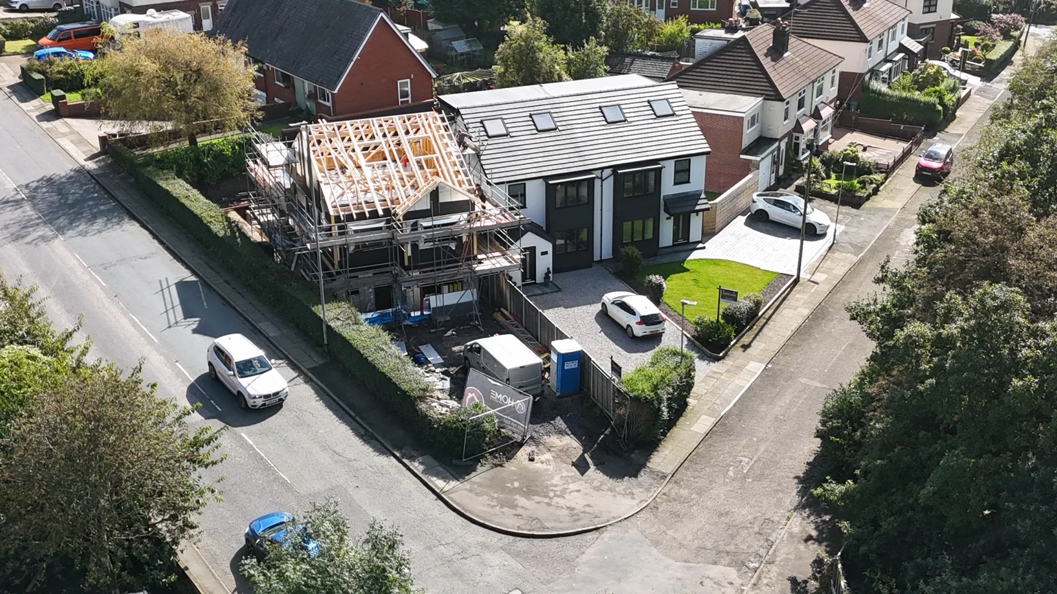 Aerial view of an exposed timber roof framework and scaffolding